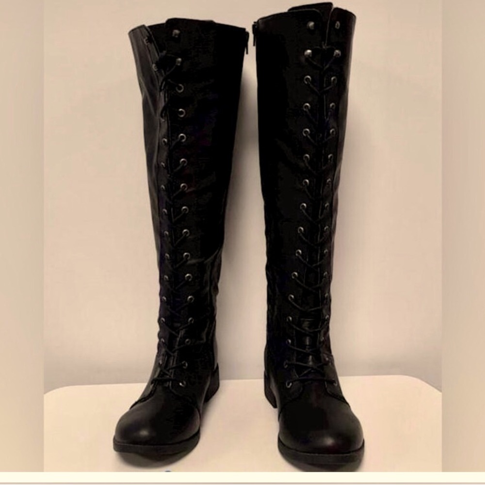 Torrid black lace up tall black combat boot. Like new 7.5